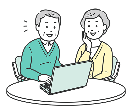 パソコンをみるシニア夫婦